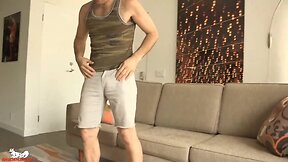 Joel starts masturbating his penis as he bends over the sofa