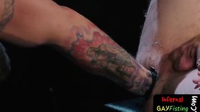 Hunky master fisting slave in 3some