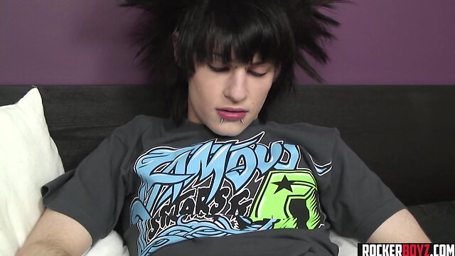Crazy hair emo teenager wanks his pecker