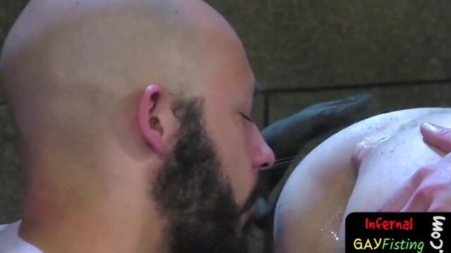 Appealing hunk fisting two assholes