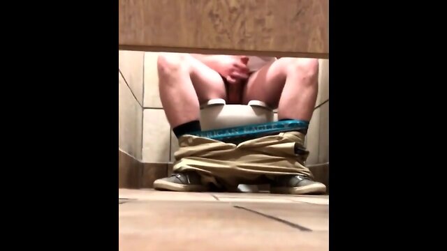 Guys stroking in the toilet cubicle spycam